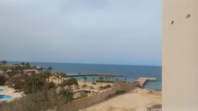a view of a beach and the ocean at Juliana Beach Resort in Hurghada