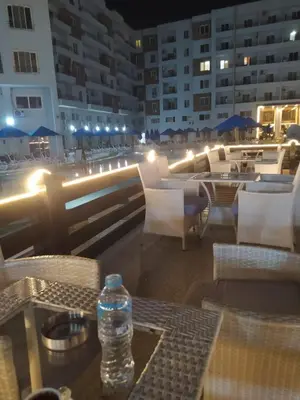 a bottle of water sitting on top of a table at C'est la vie Golden in Hurghada