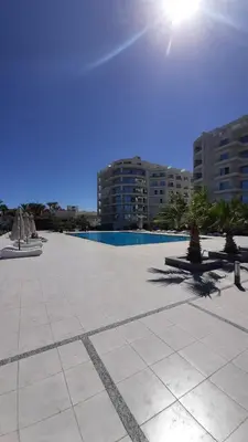 a large courtyard with a pool and some buildings at Hurghada Ägypten Scandic Resort in Hurghada