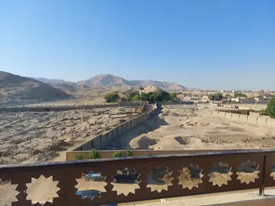 a view of the desert with mountains in the background at Carter Guesthouse Luxor 1 in ‘Ezbet Abu Ḥabashi