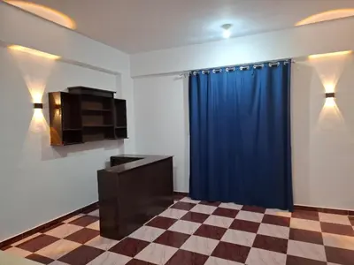 a room with a blue curtain and a checkered floor at Djorff Guest House in Luxor