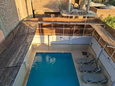 an overhead view of a swimming pool on top of a building at Djorff Guest House in Luxor