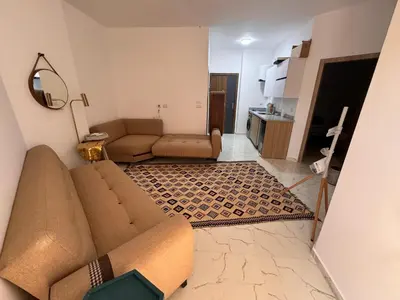 a living room with a couch and a kitchen at Hurghada seaview apartment in Hurghada