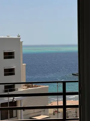 a view of the ocean from a hotel balcony at Cosy Hurghada Apartments in Hurghada