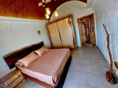 a bedroom with a large bed in a room at Komfortowy apartament na dachu w sercu miasta in Hurghada