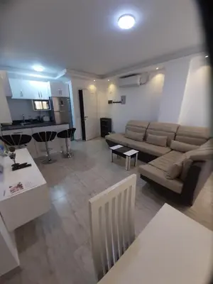 a living room with a couch and a table at SKY EL Gandoul Wohnung Hurghada in Hurghada