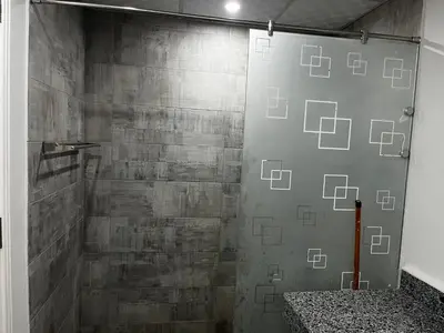 a shower with a glass door in a bathroom at Scandic sea view in Hurghada