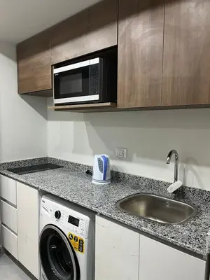 a kitchen with a washing machine and a sink at Scandic sea view in Hurghada