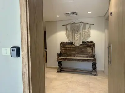 a room with a piano with a curtain on the wall at Chic 3BR Ground Free Beach & Pool access at Mangroovy in Hurghada