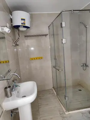 a bathroom with a shower and a sink at Stunning Rooftop 1 Bed Apartment in Hurghada