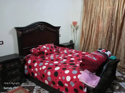 a bedroom with a bed with polka dots at SaYeD guest house in Dâbûb