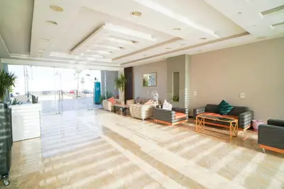 a large living room with couches and tables at Princess resort luxury G05 in Hurghada