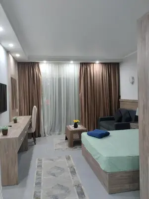 a living room with a bed and a couch at scandic in Hurghada