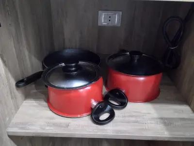 two pots sitting on a shelf in a drawer at scandic in Hurghada