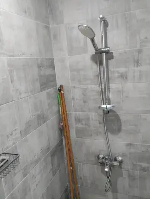 a shower with a shower head in a bathroom at scandic in Hurghada