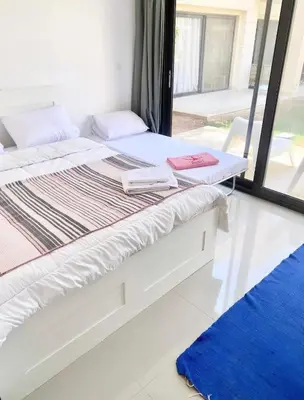 a bed with two books on it in a room at El Gouna -G-cribs B6 in El Gouna