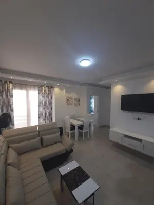 a living room with a couch and a table at Wohnung SKY EL Gandoul in Hurghada