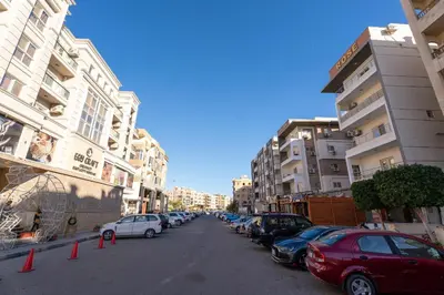 a city street with cars parked on the side of the road at Hurghada apartment luxury 002 in Hurghada