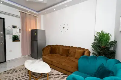 a living room with a couch and a table at Hurghada apartment luxury 002 in Hurghada