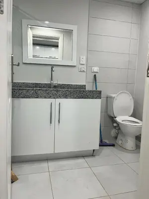 a bathroom with a sink and a toilet at scandic resort in Hurghada