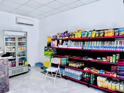 a store aisle with a chair in a store at Al Saraya Sahl Hasheesh by Peaks in Hurghada