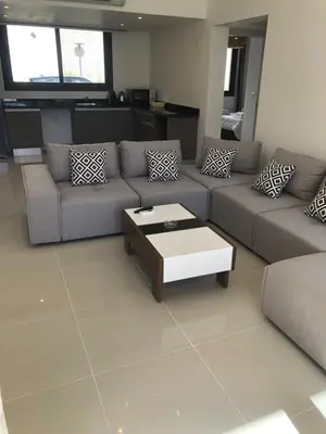 a living room with a couch and a coffee table at G cribs B15 in Hurghada