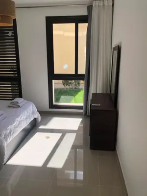a bedroom with a bed and a window at G cribs B15 in Hurghada