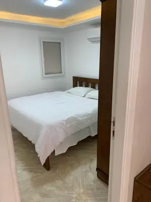 a bedroom with a white bed in a room at selena bay resort in Hurghada