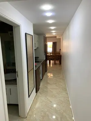 a hallway leading to a kitchen and dining room at selena bay resort in Hurghada