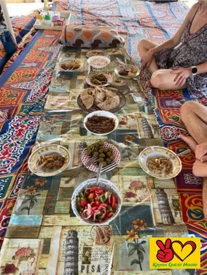 a table with many plates of food on it at Nubian Adventures - Felucca from Aswan to Kom Umbu in Aswan