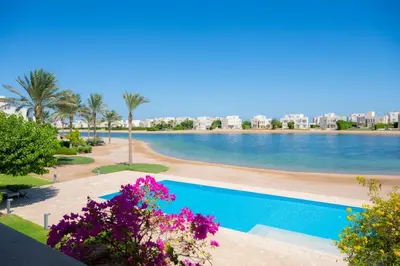 a view of a swimming pool at a resort at Nayah Stays, Joubal Lagoons flowery apartment in Hurghada