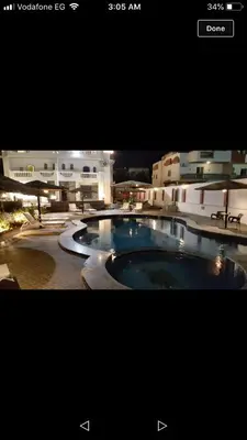 a picture of a swimming pool in front of a building at منتجع لاكشيري جميع الرفاهيات و الكماليات in Hurghada