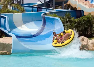 a group of people on a water slide at a resort at Titanic Aqua Park Resort - Families and Couples only in Hurghada
