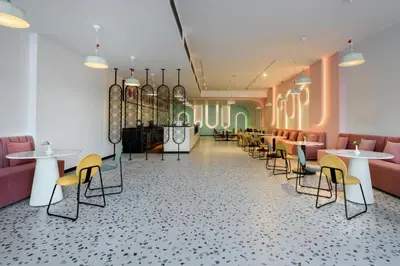 a restaurant with tables and chairs in a room at Flow Spectrum Resort Sahl Hasheesh in Hurghada