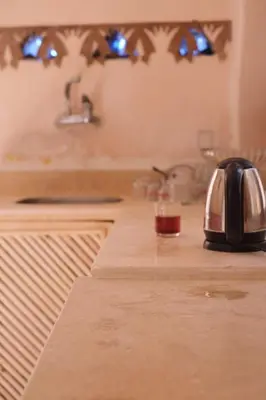 a kitchen counter with a tea kettle on a counter top at Abou El Leef villa in Luxor
