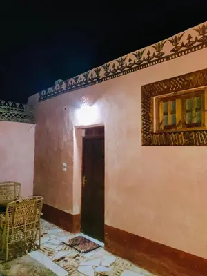 a building with a door and a window on it at Abou El Leef villa in Luxor