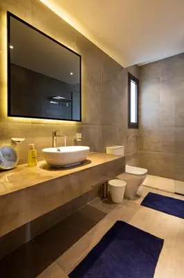 a bathroom with a sink and a toilet at Fanadir Marina Front Penthouse with Pool in Hurghada