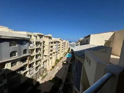 a view from a balcony of some buildings at A one-bedroom apartment with a compact terrace in Hurghada