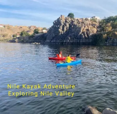 two people in kayaks on a body of water at Nile Kaiak Adventure in Aswan