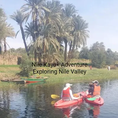 three people are riding on kayaks on the water at Nile Kaiak Adventure in Aswan