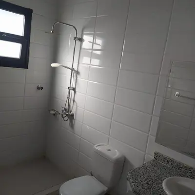 a bathroom with a shower and a toilet and a sink at Villa River Nile in Al Qurnah