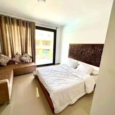 a bedroom with a large bed and a window at Studio Escape G Cribs in Hurghada