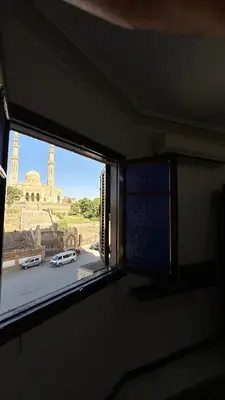 a window in a room with a view of a building at Aswan apartment-Center of Aswan in Aswan