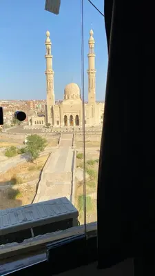 a view of a mosque from a window at Aswan apartment-Center of Aswan in Aswan