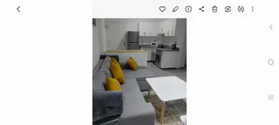 a living room with a couch and a table at Spacious and modern one bed in hurhgarda in Hurghada