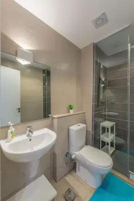 a bathroom with a sink and a toilet and a shower at Chic 2 BR poolside Apartment at G-crib El Gouna in Hurghada