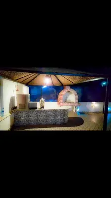 a view of a kitchen with a counter in a room at C and S park in Hurghada