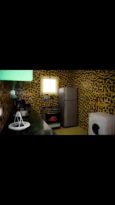 a kitchen with a refrigerator and a stove at C and S park in Hurghada
