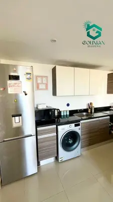 a kitchen with a stainless steel refrigerator and a dishwasher at ElGouna G-cribs One Bedroom in Hurghada