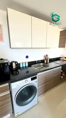 a kitchen with a washing machine and a sink at ElGouna G-cribs One Bedroom in Hurghada